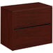 A mahogany HON 10500 Series two-drawer lateral filing cabinet.