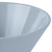 A Tablecraft gray cast aluminum serving bowl with a white interior and light blue rim.