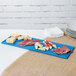 A Tablecraft sky blue rectangular cast aluminum tray with meat and cheese on it.