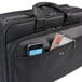 A black Solo Classic Smart Strap briefcase with a phone and other items in it.