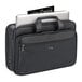 A Solo black laptop briefcase with a smart strap.