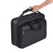 A hand holding a black Solo Classic Smart Strap briefcase.