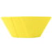 A yellow Tablecraft round cast aluminum serving bowl.