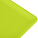 A lime green Tablecraft cast aluminum rectangular cooling platter.