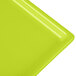 A lime green Tablecraft rectangular cast aluminum cooling platter.