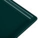 A rectangular dark green Tablecraft cast aluminum cooling platter.