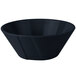 A black bowl with blue speckles on a white background.