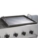 A Crown Verity griddle plate on a grill.