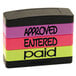 A stack of colorful rubber stamps including a yellow, purple, and black Stack Stamp with the words approved, entered, and paid.