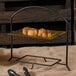 A Clipper Mill black iron powder coated 2 tier table riser with food on it.
