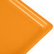 An orange cast aluminum rectangular cooling platter with an orange surface.