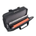 A black Solo Pro CheckFast briefcase with a red folder inside.
