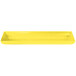 A yellow Tablecraft rectangular cast aluminum platter with a white border.