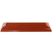 A copper cast aluminum rectangular platter with flared edges.