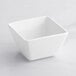 An Acopa bright white square porcelain bouillon bowl.