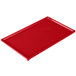 A red rectangular cast aluminum Tablecraft cooling platter.