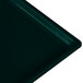 A close-up of a Tablecraft hunter green rectangular cast aluminum cooling platter.