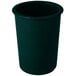 A hunter green and white speckled cast aluminum crock with a white background.