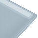 A close-up of a gray Tablecraft cast aluminum rectangular cooling platter.