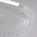 A clear plastic tray with a scalloped edge.