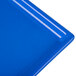 A close-up of a blue rectangular Tablecraft cooling platter.