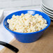 A Tablecraft cobalt blue cast aluminum serving bowl filled with macaroni salad.