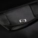 A close up of a black Solo Pro Slim briefcase with the logo on it.