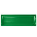 A green rectangular cast aluminum platter with white edges.