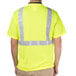 A man wearing a Cordova lime yellow high visibility shirt with reflective tape.