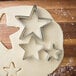 A Wilton metal star cookie cutter on dough.