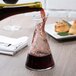 A Stolzle Pisa carafe being poured into.