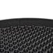 A black polypropylene pizza tray with small black balls on the surface.