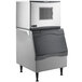 A white and silver Scotsman air cooled ice machine with a stainless steel rectangular vent.