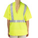 A person wearing a yellow Cordova high visibility shirt with reflective stripes.