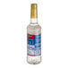 A Torani plastic bottle with a blue label.