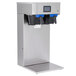 A silver Curtis dual tea and coffee brewer with black and blue water dispensers.