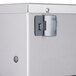 A close-up of a silver metal box with a door.
