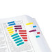 Several Redi-Tag mini colorful arrow page flags on a book.