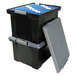 A stack of black Storex portable file storage boxes with blue file folders inside.