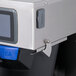 A close up of a Curtis Polaris tea brewer with a screen.