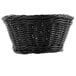 A Tablecraft black oval rattan basket with a handle.