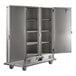 A large stainless steel Metro banquet cabinet with open doors.