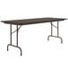 A walnut rectangular Correll folding table with a metal frame.