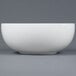 A CAC Bright White Porcelain Salad Bowl.