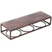 A brown metal Clipper Mill by GET rectangular shelf with three metal rings on a brown wooden table.