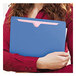 A woman holding a blue Smead file jacket.
