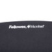A black Fellowes PlushTouch fabric mouse pad with wrist rest.