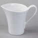 A Schonwald white porcelain creamer with a handle.