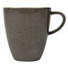 A dark gray Schonwald porcelain cup with a handle.