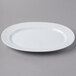 A Schonwald oval white porcelain platter with a wavy design.